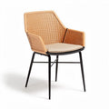 Woven rattan outdoor chair with black metal legs and cream cushion 50 x 55 x 80cm